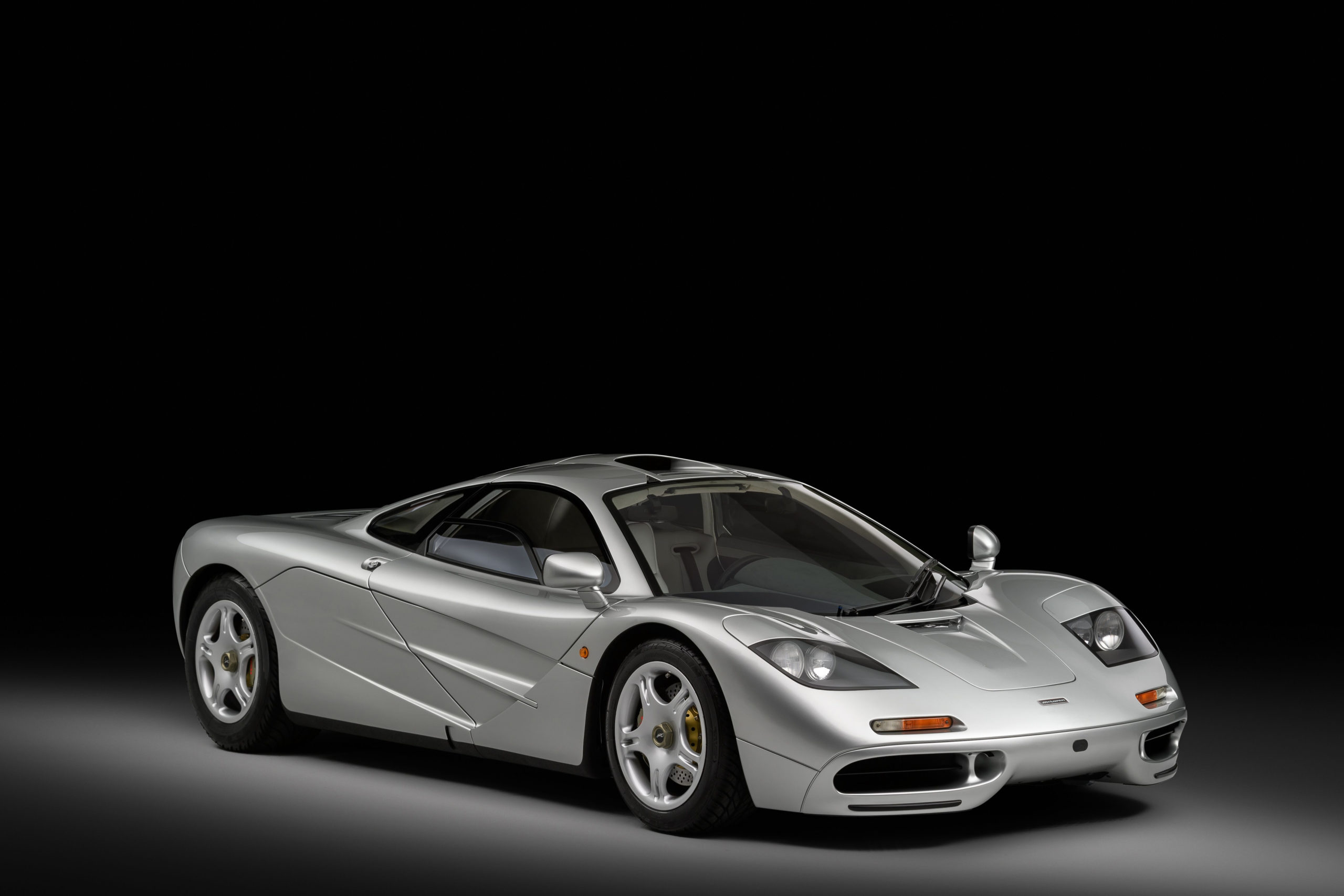 1992 McLaren F1 supercar, an automotive engineering masterpiece celebrated for its lightweight design and central driving position. Copy